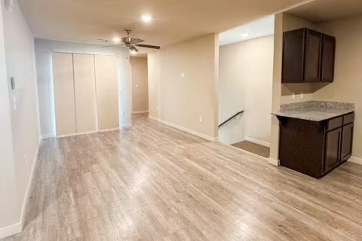 Living area with access to kitchen at Atlas at Cabot in Cabot. AR