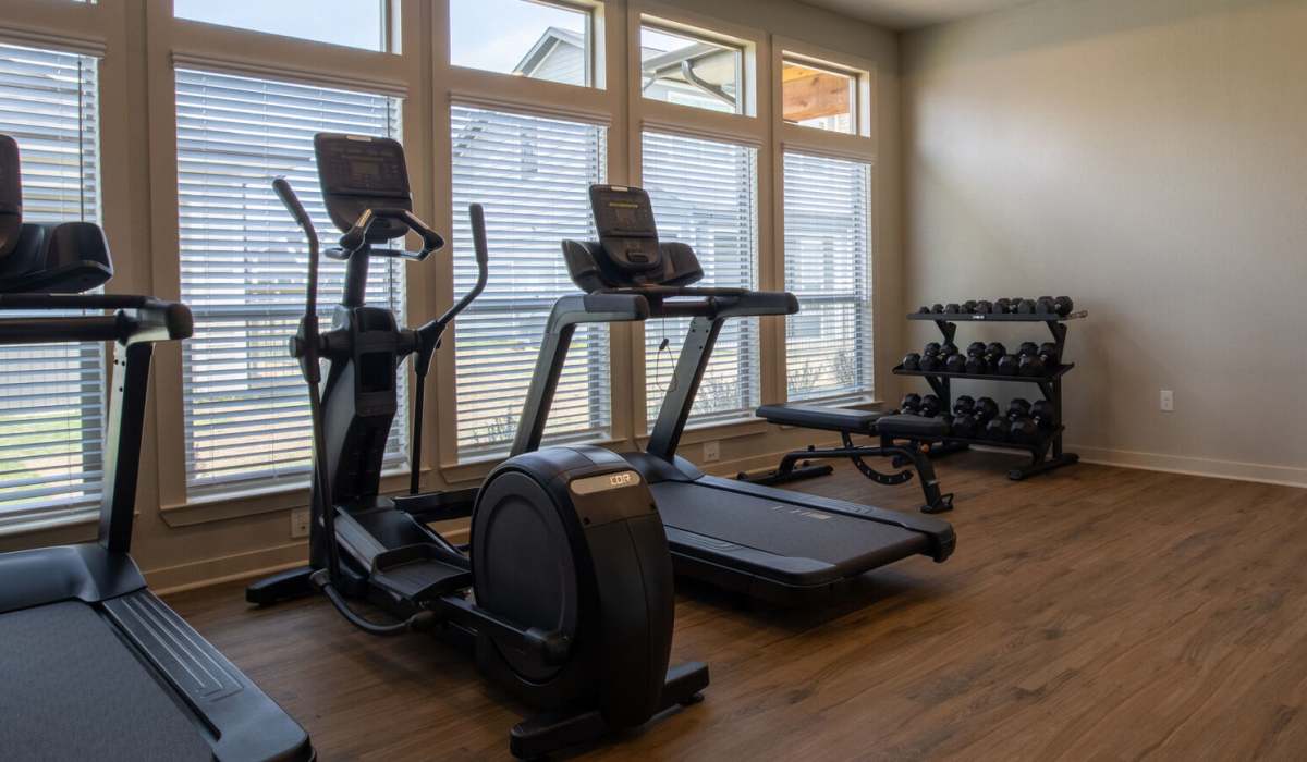 Fitness center with treadmill at Home At Waller in Waller, Texas