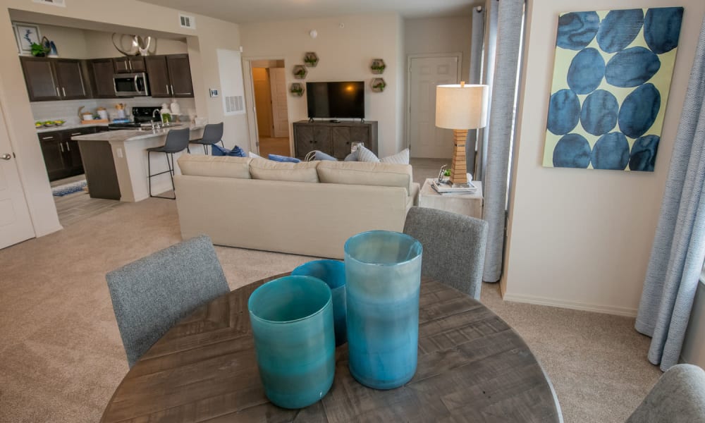 Open floor plan with living room and dining nook at Redbud Ranch Apartments in Broken Arrow, Oklahoma