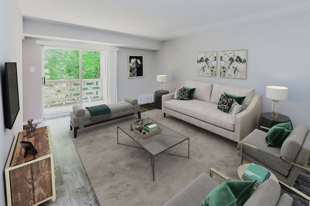 Beautiful model living room opening onto a private balcony at Marchwood Apartment Homes in Exton, Pennsylvania