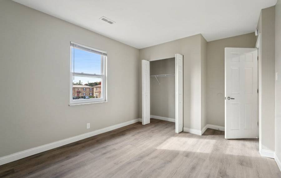 Bedroom with walk-in closet at Charleston Square Apartments in Columbus, Indiana