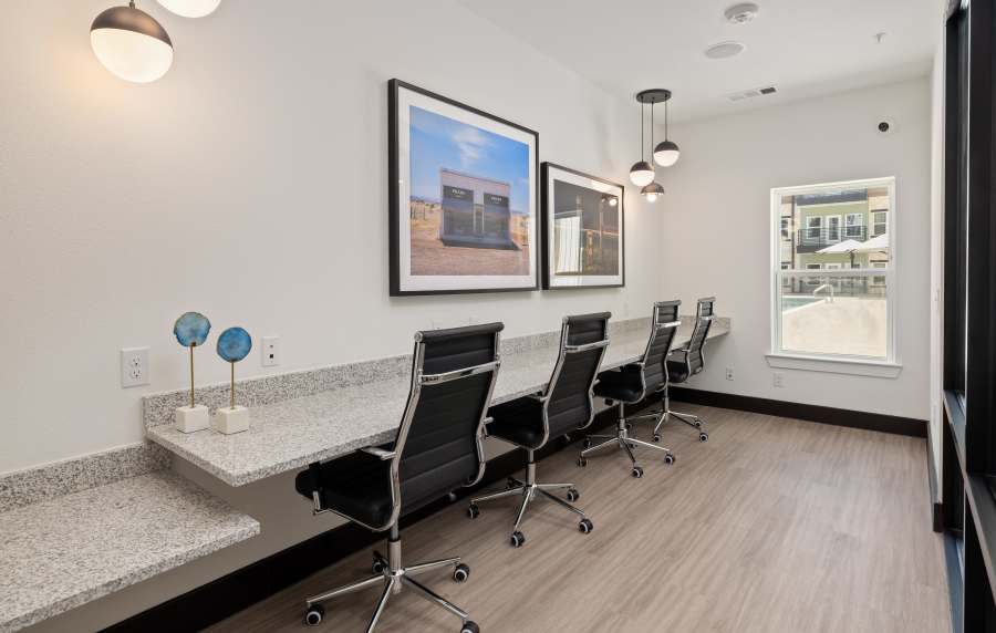 Business center with chairs at Henderson on Reinli in Austin, Texas