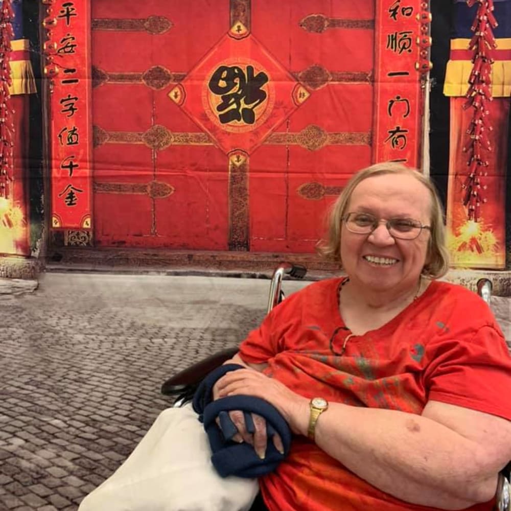 A resident posing for a picture at Inspired Living Sun City Center in Sun City Center, Florida