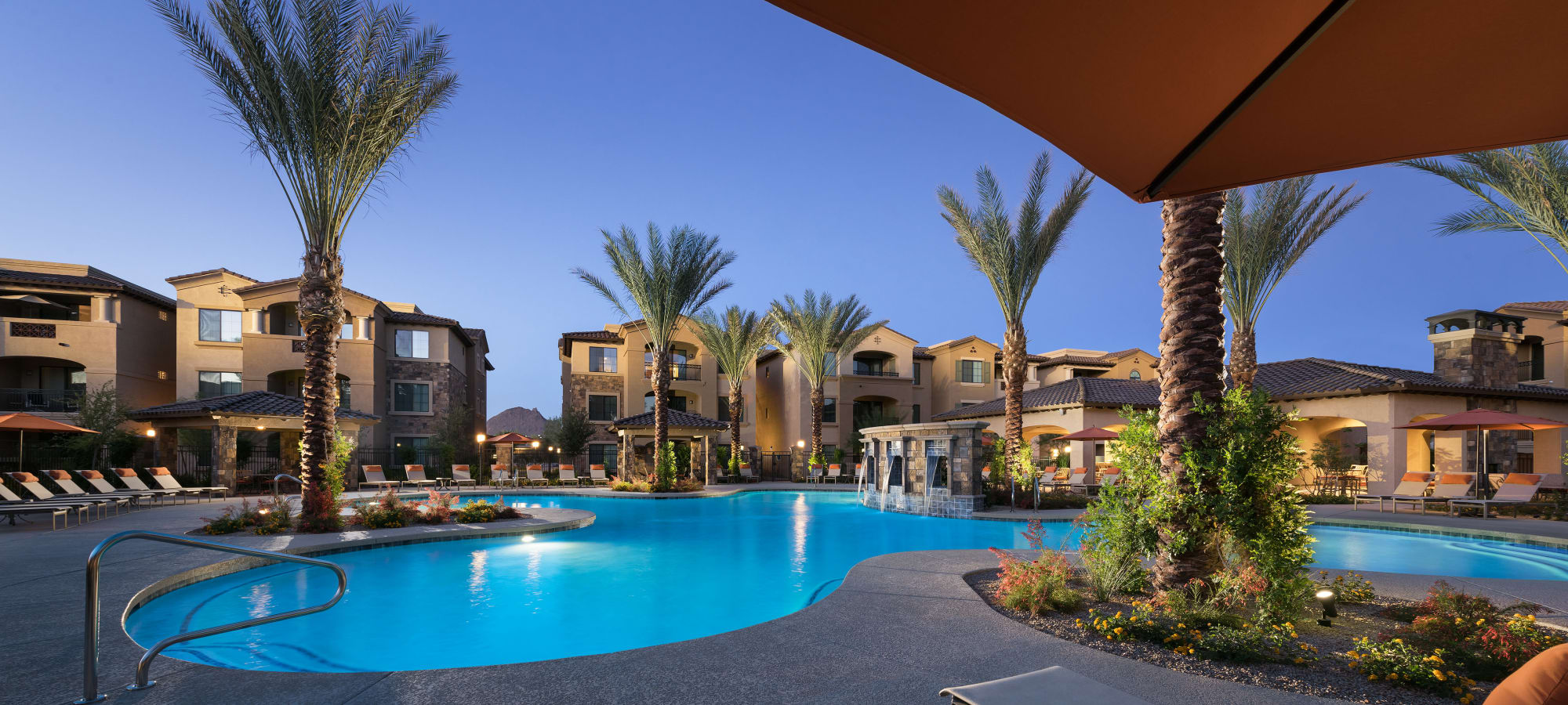 San Portales resort-style swimming pool during dusk at San Portales in Scottsdale, Arizona