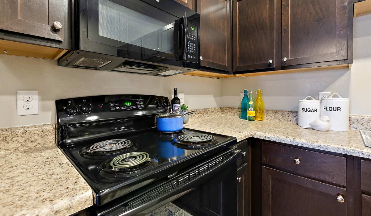 Kitchen with electric range at Canyon House in New Braunfels, Texas