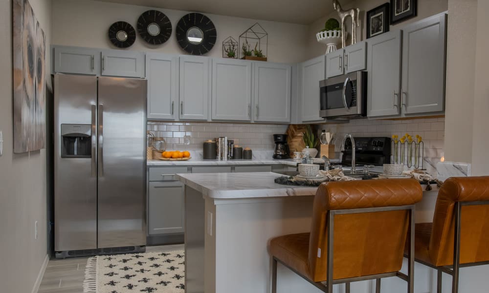 Bright and fully equipped kitchen at Redbud Ranch Apartments in Broken Arrow, Oklahoma