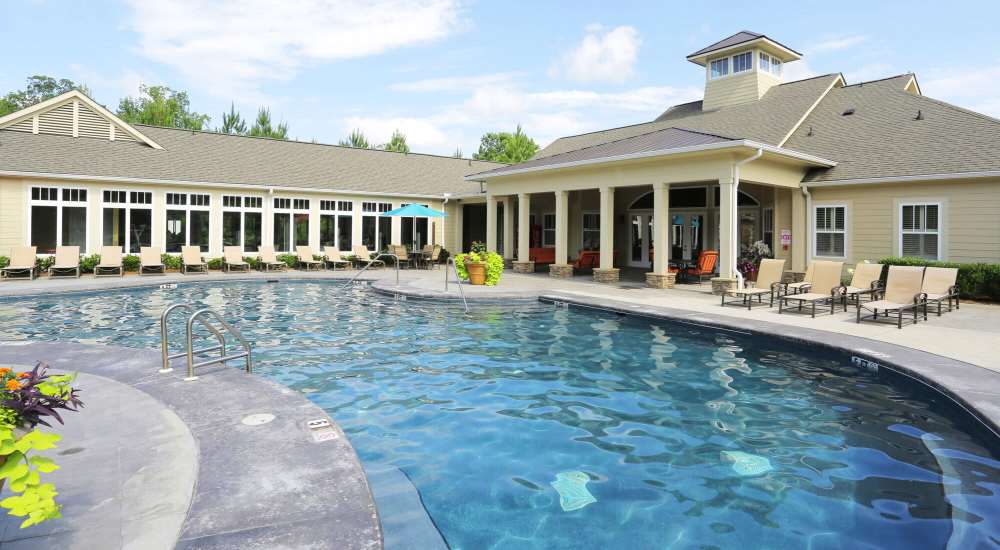 Shimmering pool with sundecks at Preserve At Columbus Park in Columbus, Georgia