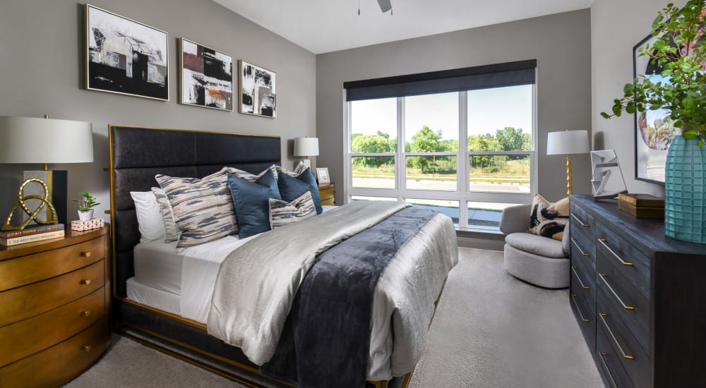 Modern and bright bedroom at Xenia Apartments in Golden Valley, Minnesota