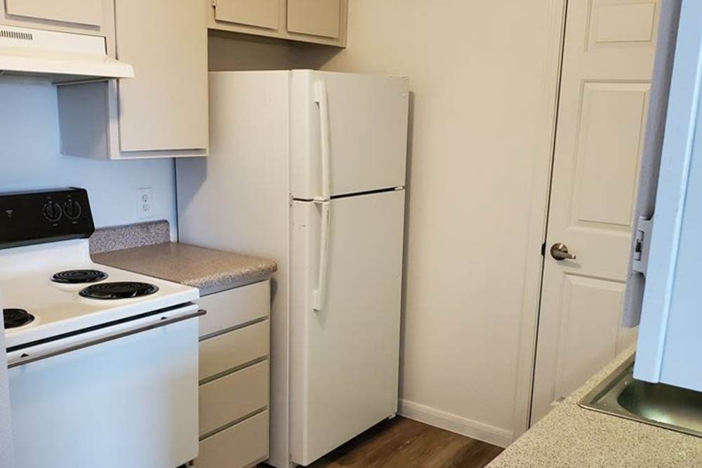 Kitchen with stainless-steel appliances at Autumn Brook Apartments in Chickasha, Oklahoma