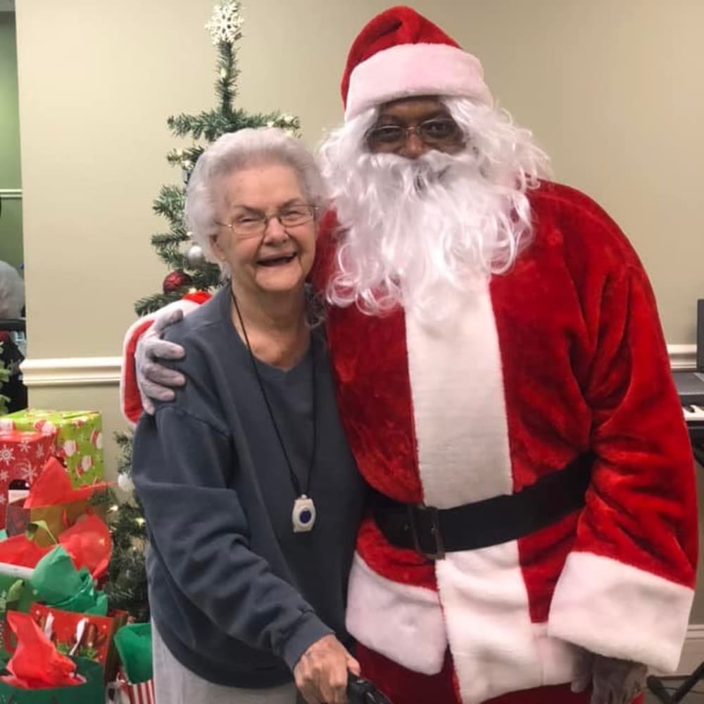 Resident and a staff member dressed as Santa at English Meadows Laurens Campus in Laurens, South Carolina