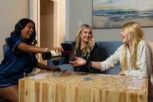 three girls drinking wine at The Waters at Redstone in Crestview, Florida