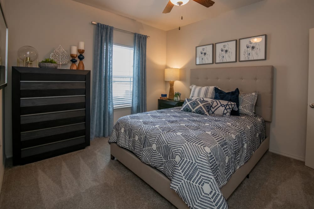 Carpeted bedroom at Redbud Ranch Apartments in Broken Arrow, Oklahoma