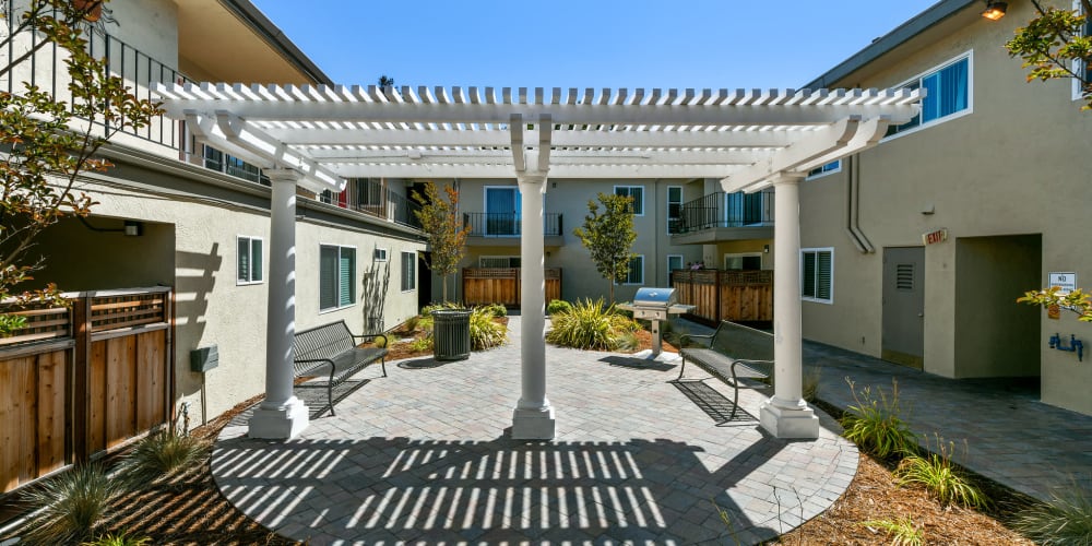 Outdoor courtyard area with patio at Marina Haven Apartments in San Leandro, California