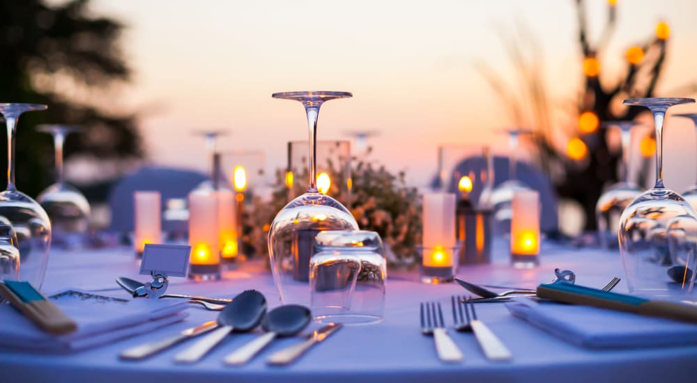 glass and silverware on a table outside at Old Town Square in Pompano Beach, Florida