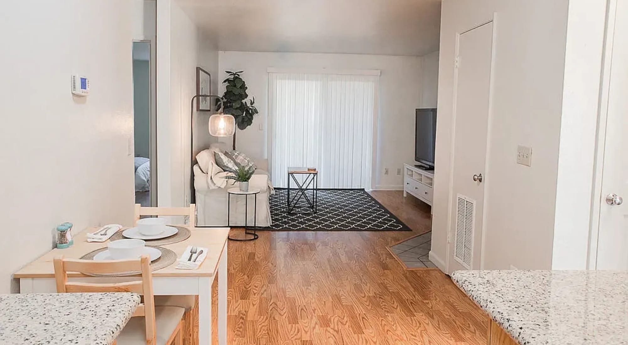 Dining area beside the living room at Walnut Apartments in Santa Rosa, California