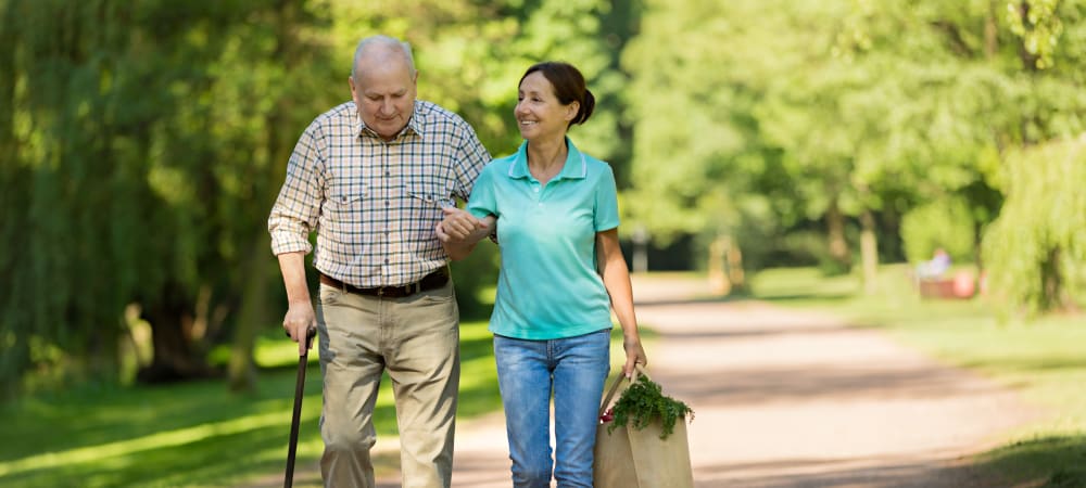 Caregiver helping resident get groceries at WellQuest of Menifee Lakes in Menifee, California