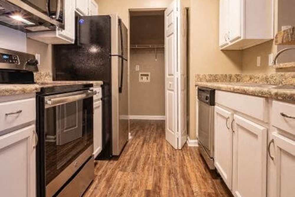 Apartment kitchen with stainless-steel appliances and ample cabinet space at Berry Shoals in Duncan, South Carolina