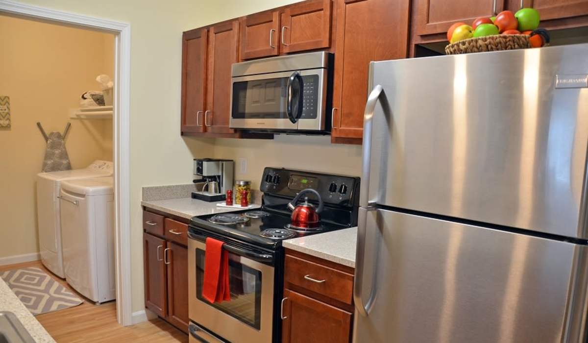 Kitchen with laundry at The Enclave Apartments in Columbus. IN