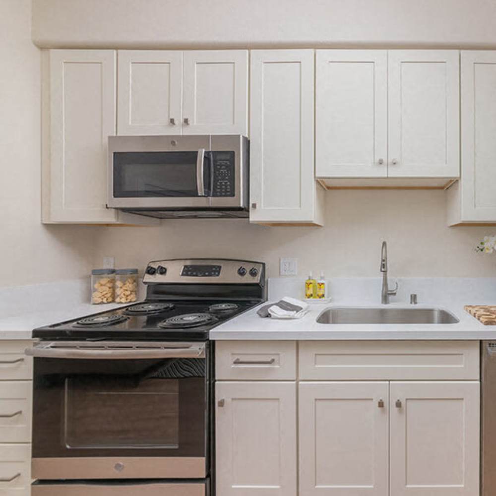 Cute kitchen with stainless-steel appliances at The Breakers in Santa Cruz, California