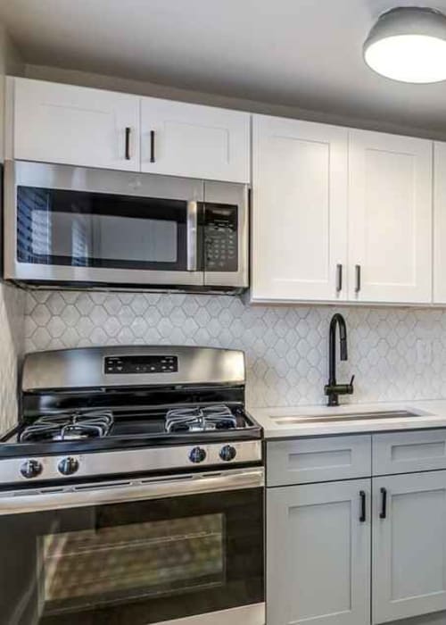 Kitchen with stainless-steel appliances at Haven New Providence in New Providence, New Jersey