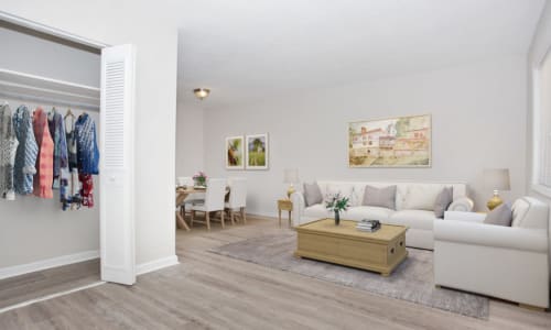 Hardwood flooring and furniture in a model apartment living room at Residence at Marathon in Columbus, Georgia