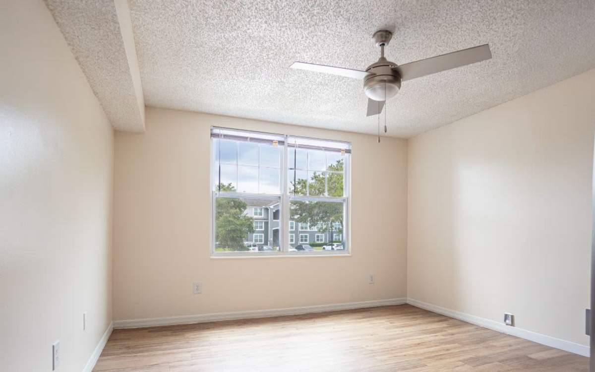 Unfurnished bedroom with ceiling fan at Logan Heights in Sanford, Florida