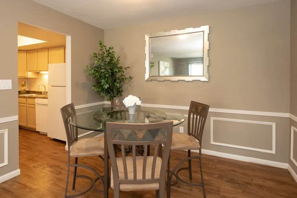 A dining room with a glass table and chairs at Andover Park, Valparaiso, Indiana