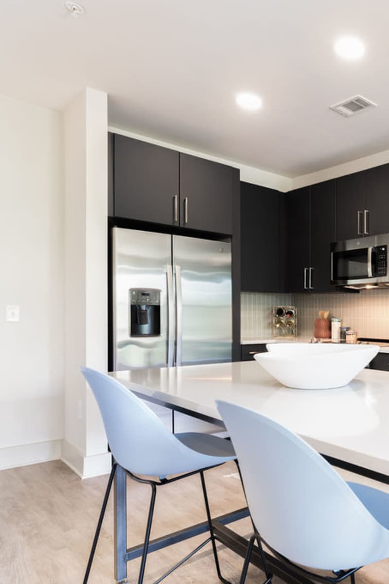 Kitchen with stainless-steel appliances at Channel House in Raleigh, North Carolina