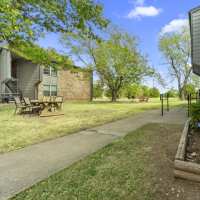 Outdoor resident dining area at Cleburne Plaza in Cleburne, Texas