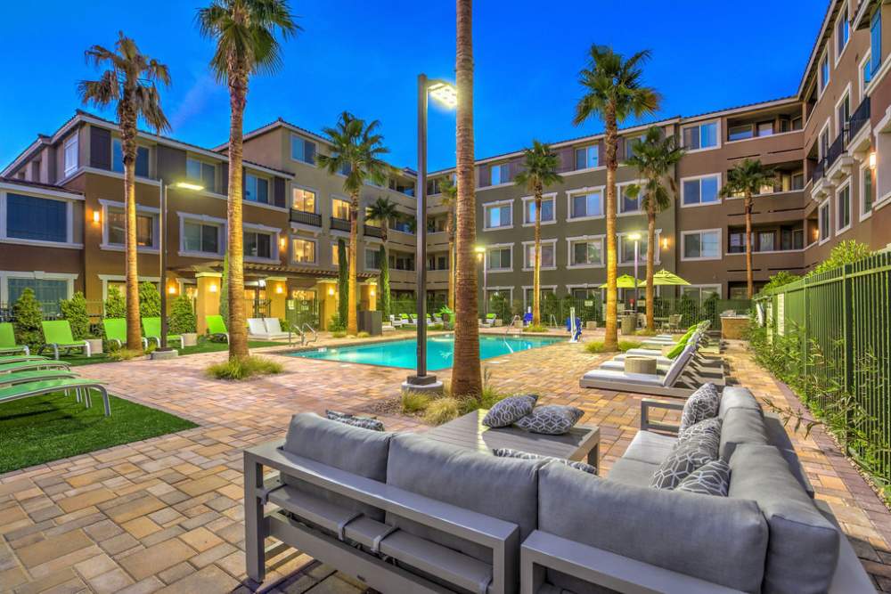Pool with chairs and tress at Harmony in Las Vegas, Nevada