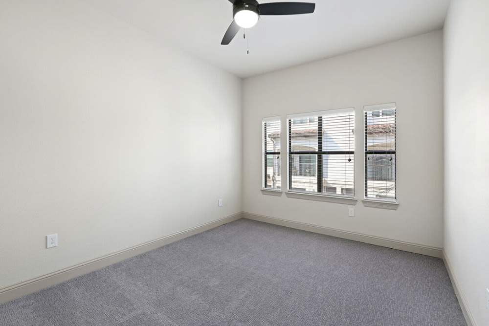 Unfurnished bedroom withh large window at Domain Memorial in Houston, Texas