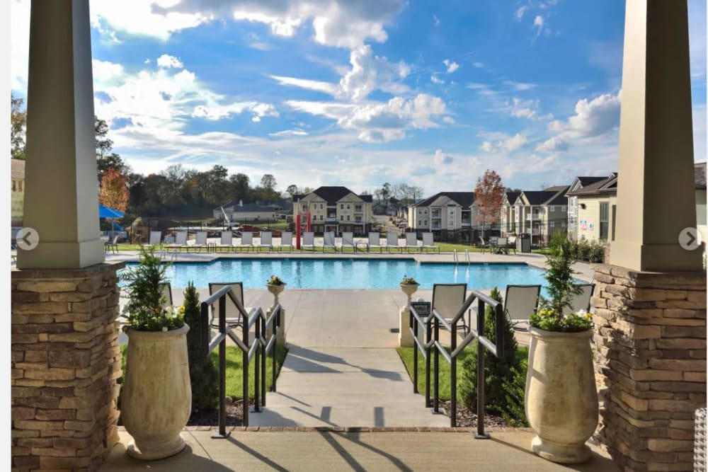 Gorgeous day approaching the swimming pool area at The Retreat at Arden Village Apartments in Columbia, Tennessee