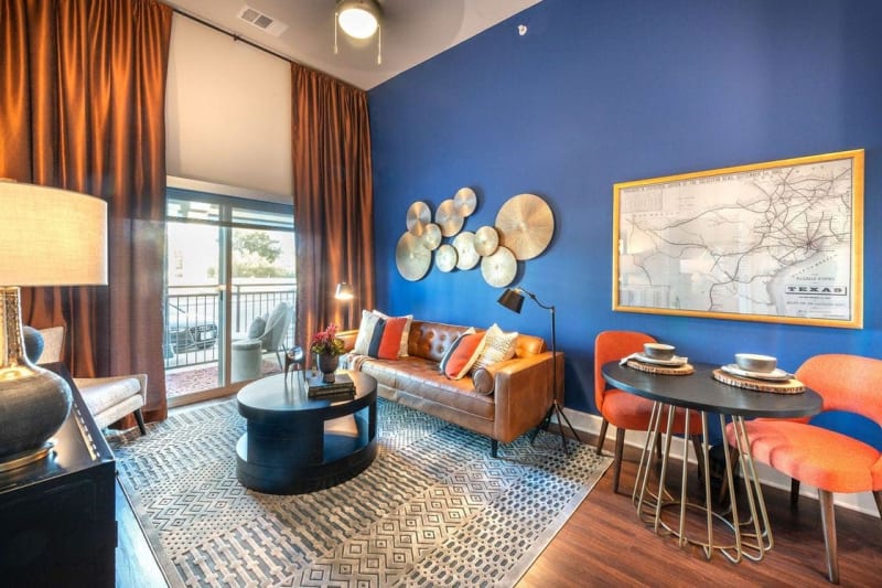Modern furnishings in a model apartment's living area at Switchyard in Carrollton, Texas