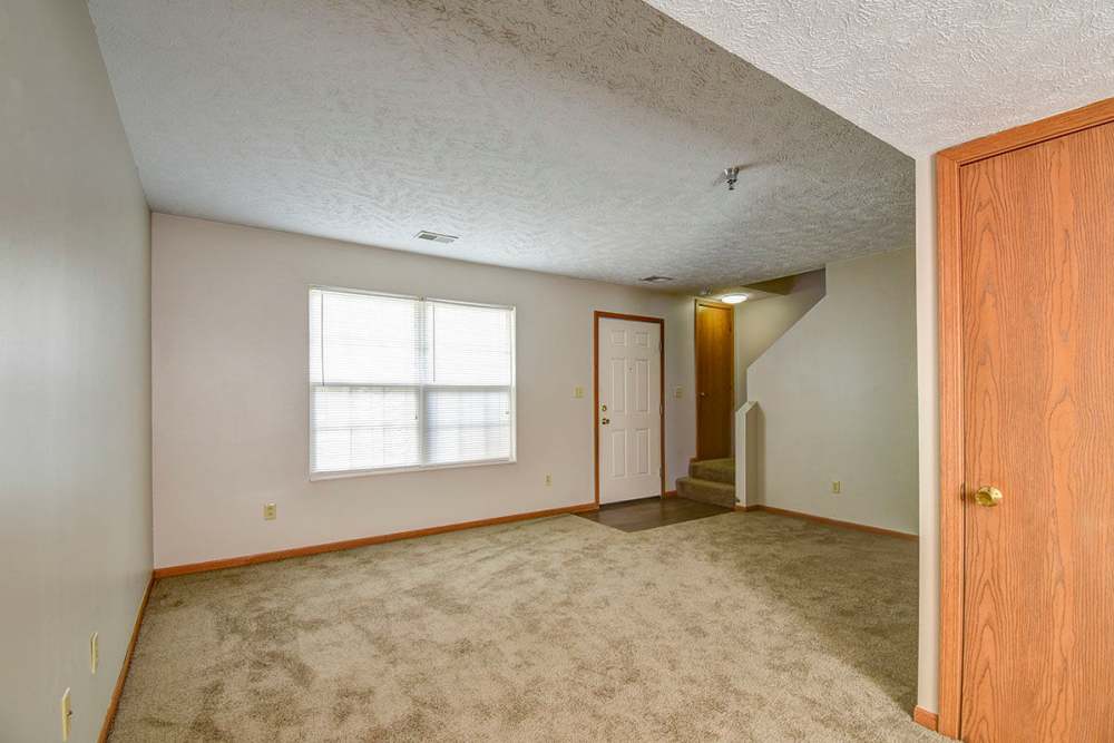 Living space with hallway leads to a staircase at Greene Glen in Morgantown. WV