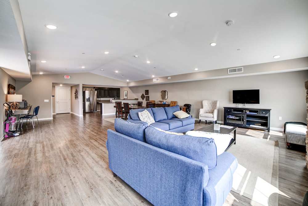 Community clubhouse with couch and tv at Thompson Greene in Butler. PA