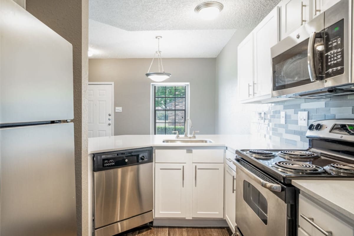 Stainless-steel appliances in a home's kitchen at Cottages at Wells Branch in Austin, Texas