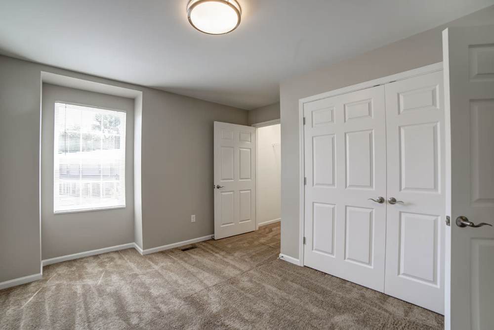Well-lit bedroom with closet space at Dawn Ridge in Carlisle, Pennsylvania