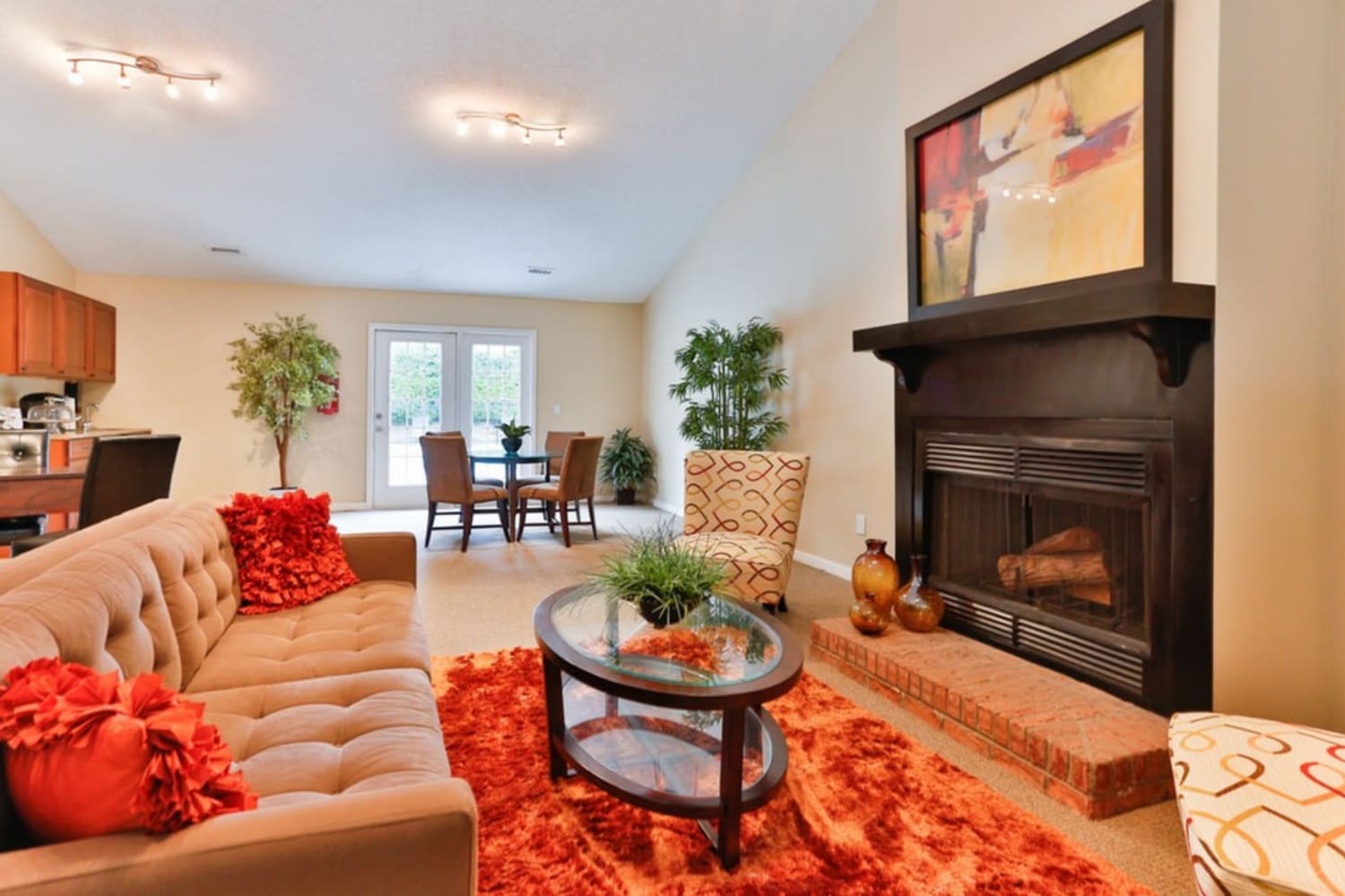 Resident clubhouse with a fireplace at Huntersville Apartment Homes in Huntersville, North Carolina