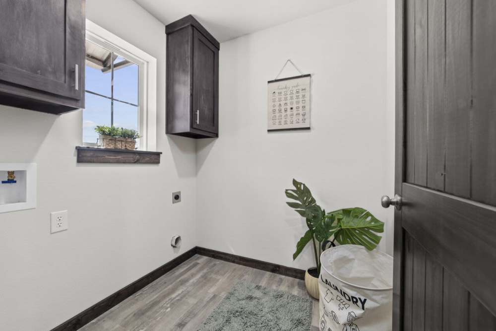 Laundry room at Settlers Trail Apartments in Lindale, Texas