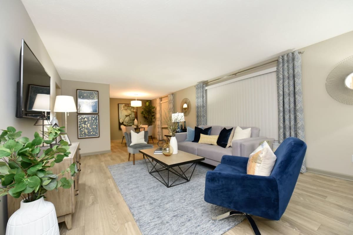 Spacious living room with wood flooring at Veridian Castleton in Indianapolis, Indiana