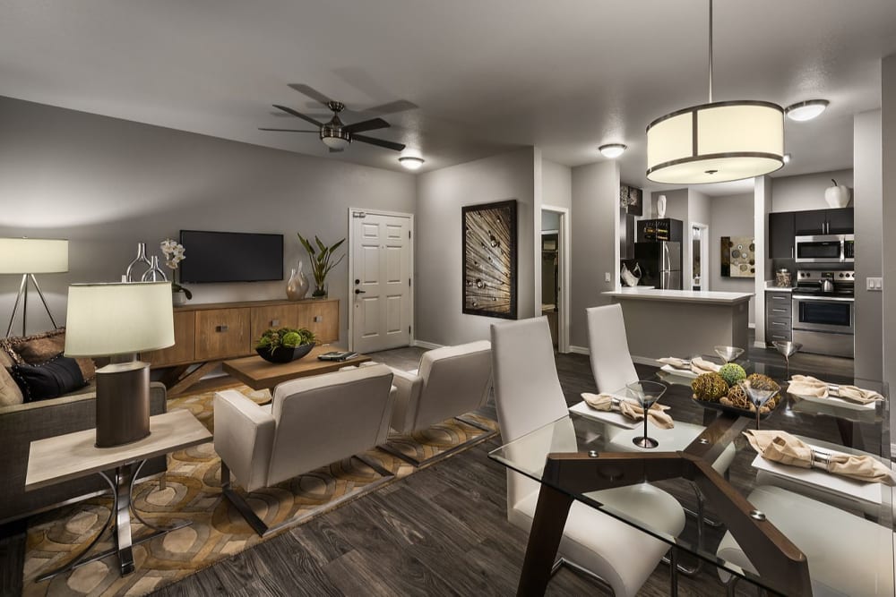 Spacious living room with plush carpeting at Avenue 25 in Phoenix, Arizona