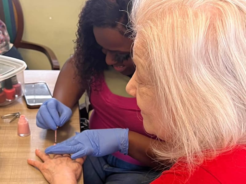 Resident getting her nails done at Carolina Gardens at Conway in Conway, South Carolina