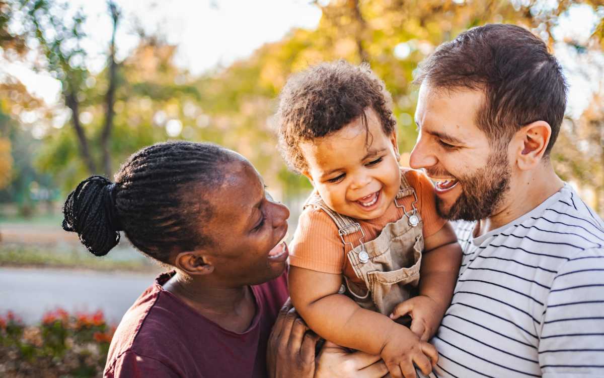 Happy resident family in the neighborhood near El Jardin Apartments in Hollywood, Florida