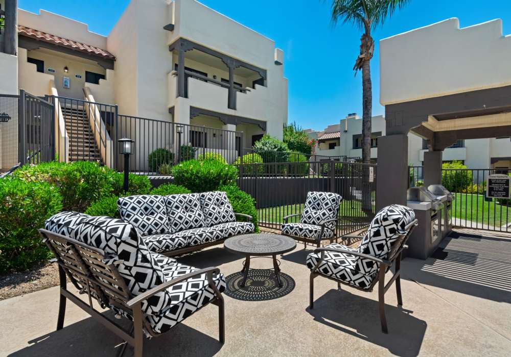 Outdoor community seating area by gazebo at Casa Santa Fe Apartments in Scottsdale, Arizona