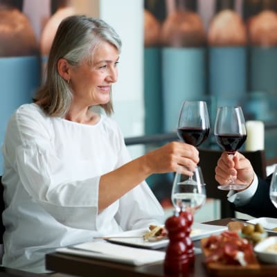 Residents chatting at their favorite local restaurant after work near Madison Sammamish Apartments in Sammamish, Washington