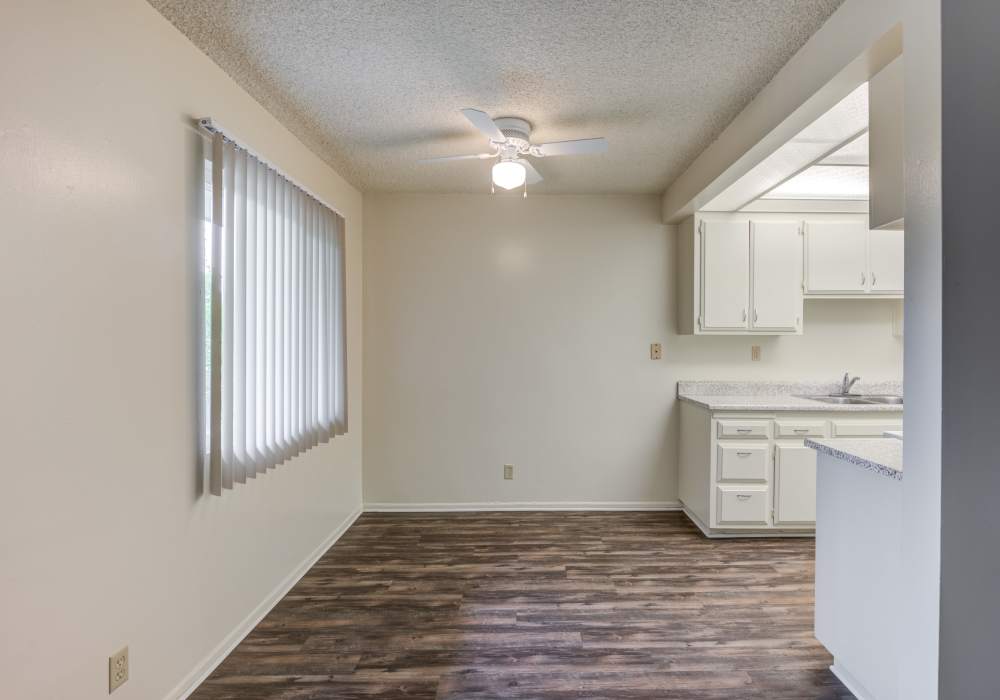 Dining area with ceiling fan at Chatham Village in Tustin, California