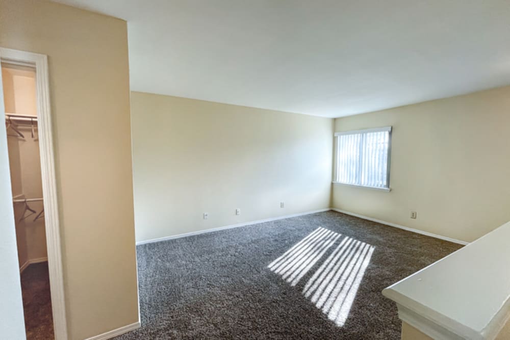Bedroom with carpet flooring at Stonehaven Apartments in Hazelwood,Missouri