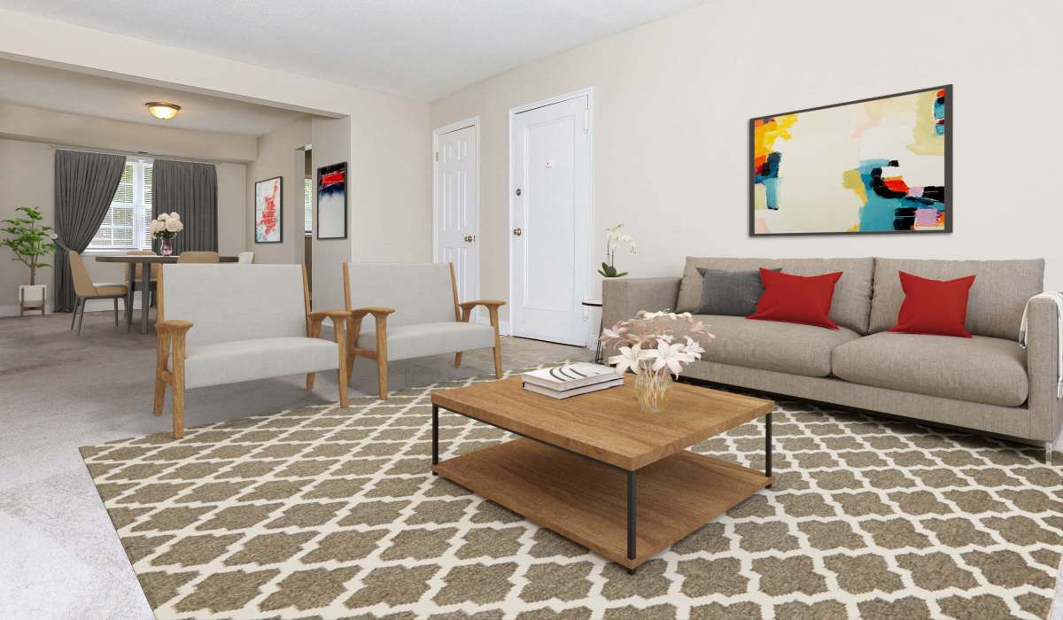 Spacious living room with wooden center table at Parkland Village in District Heights, Maryland