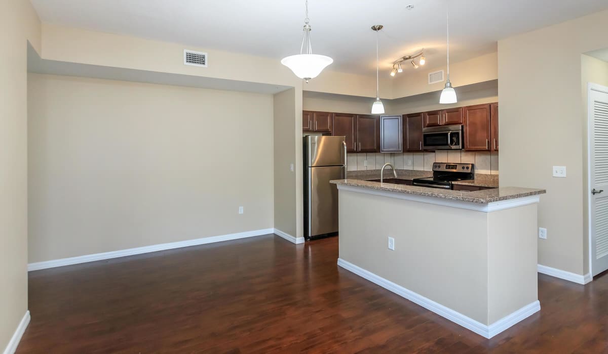 Apartment kitchen with island at Adagio at Westshore Palms in Tampa, Florida