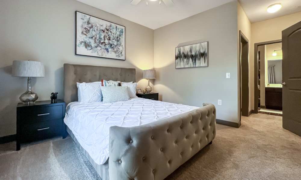 Well-furnished bedroom in a model apartment at District 119 in Oklahoma City, Oklahoma